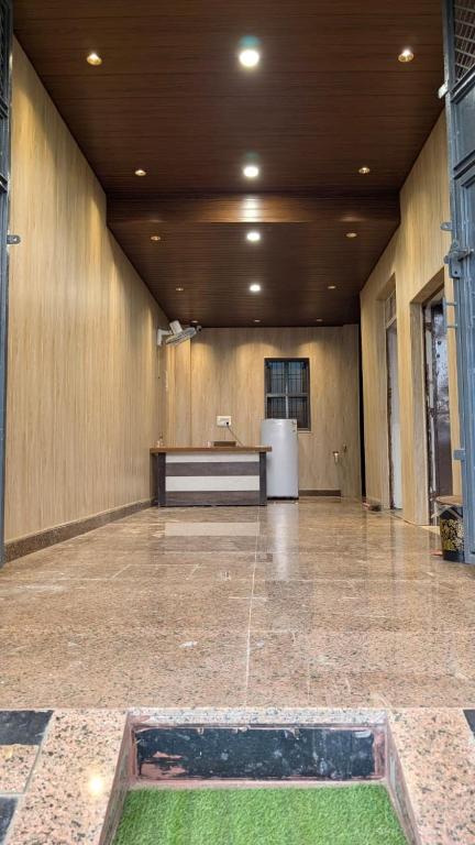 a large room with a fountain in the middle of a building at Hotel Moonlight in Chhatikara