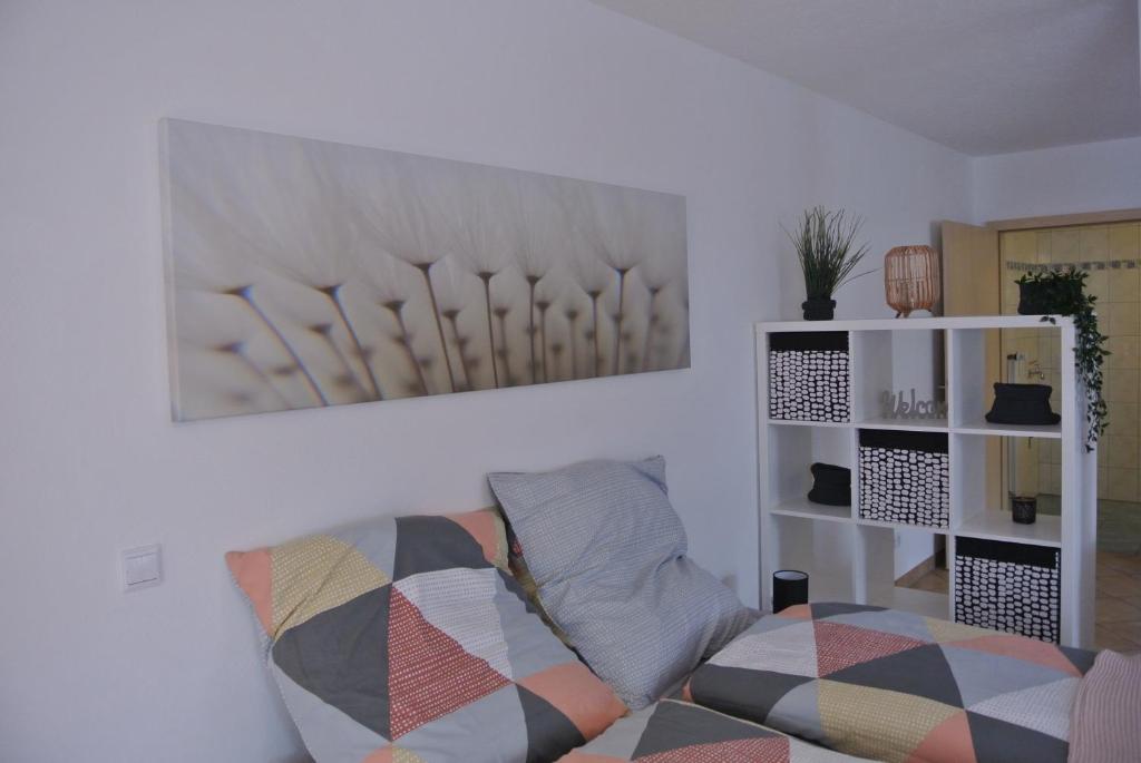 a living room with a couch and a picture on the wall at Ferienwohnung in Bad Schwalbach in Bad Schwalbach