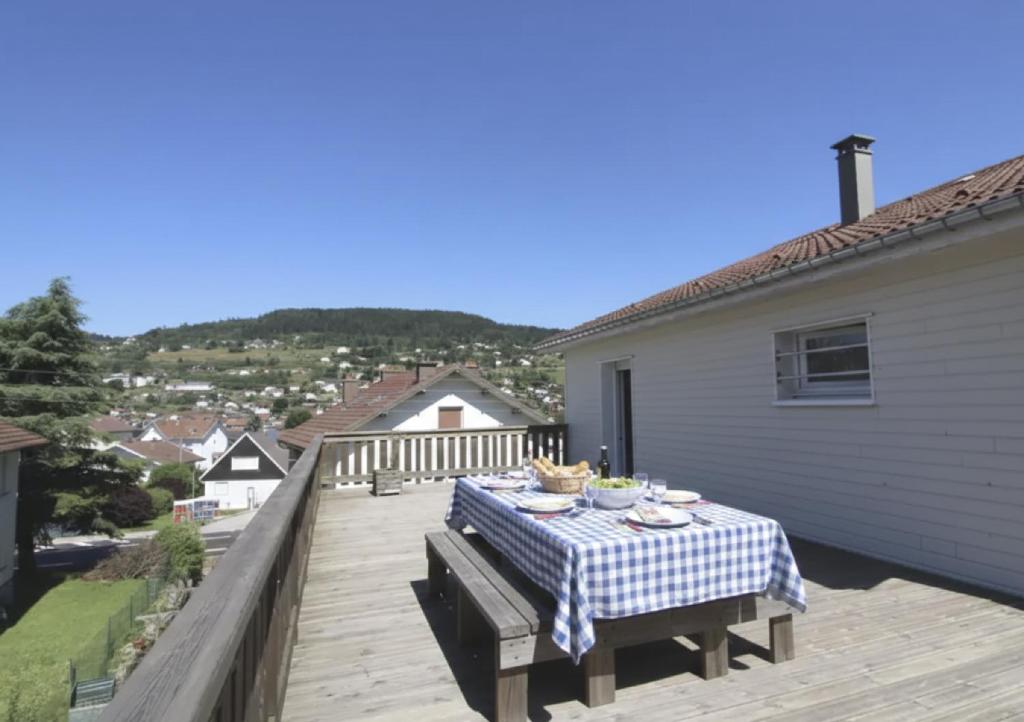 a table with a platter of food on a deck at LE CANT DE JUME in Gérardmer