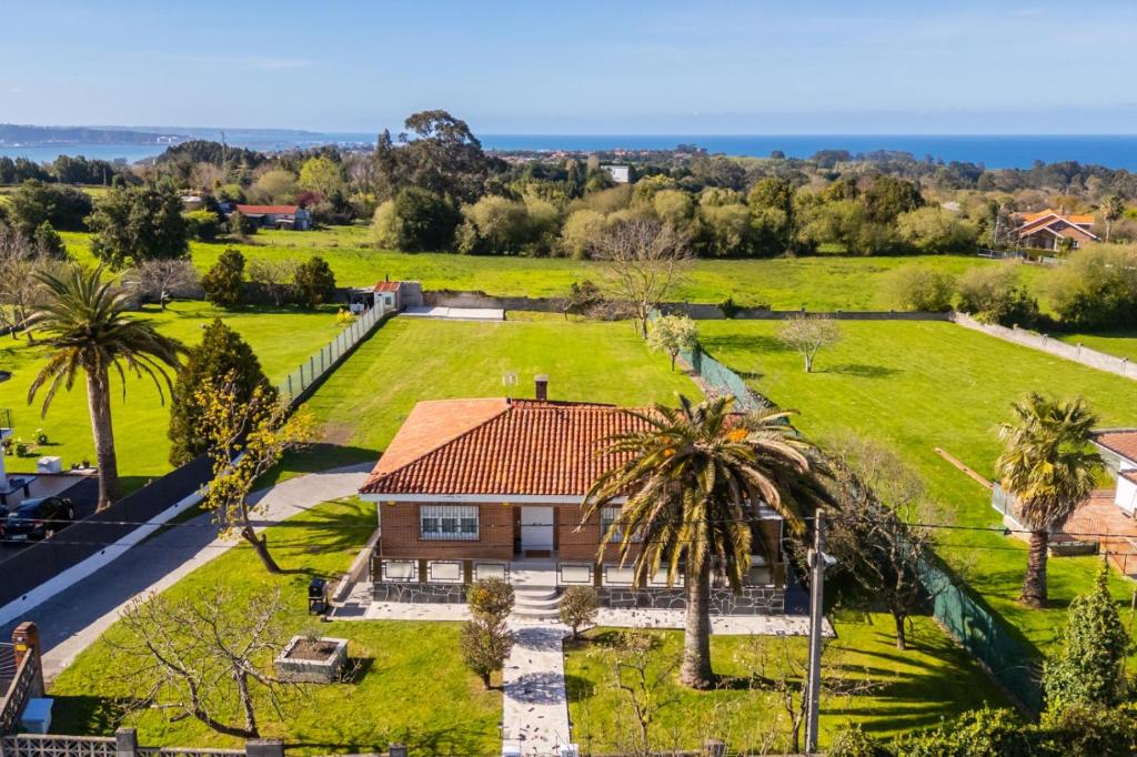 an aerial view of a house with a large yard at Villa Si y No in Gijón