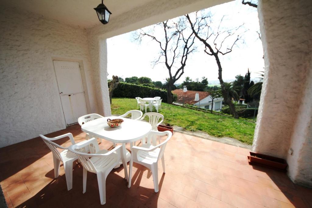 a white table and chairs on a patio at Villa Pentalocale cod 168- Taunus Vacanze in Numana