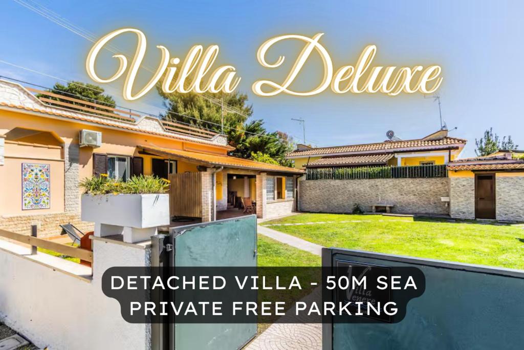 a house with a sign that reads villaclipse at 'Villa Vènere Deluxe' 50mt Sea-Jacuzzi-Free Parking-Garden in Terracina