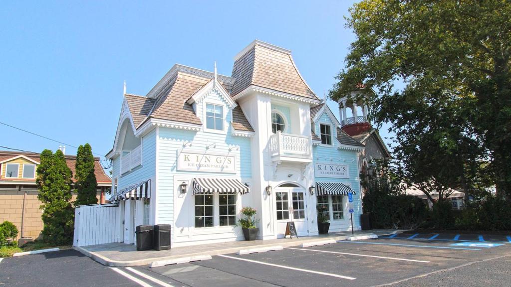 a blue and white building in a parking lot at The Ocean Loft At Kings in Cape May