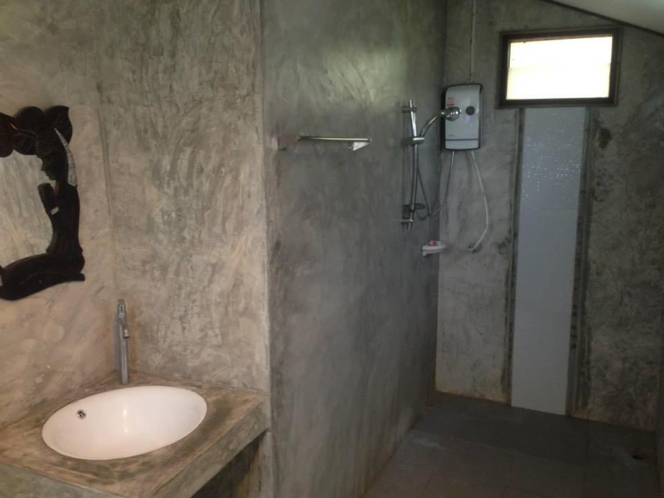a bathroom with a sink and a shower at Monkeaw in Mae On