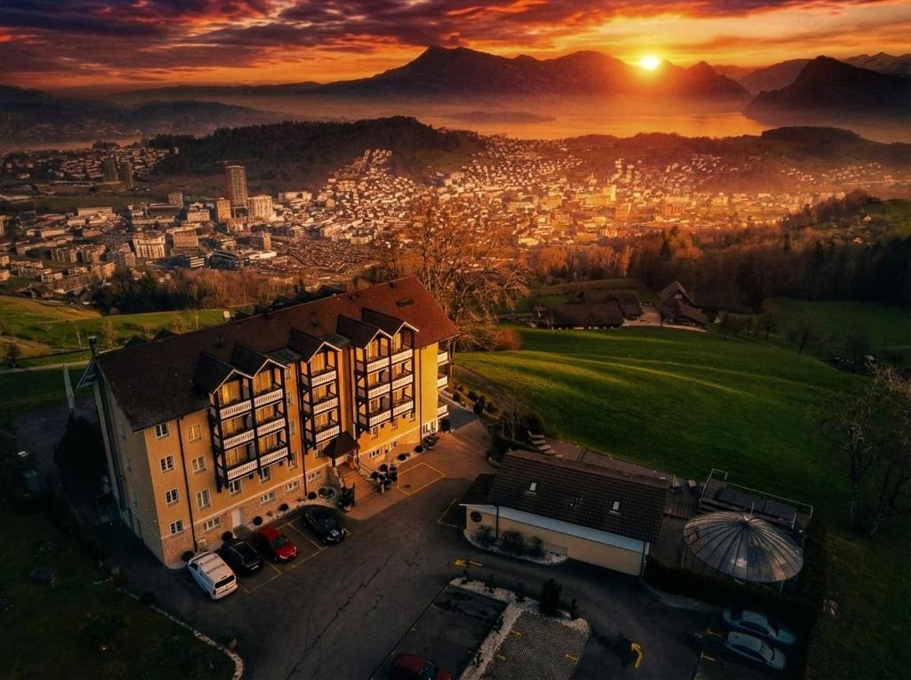 an aerial view of a city at sunset at Boutique Hotel Himmelrich in Lucerne