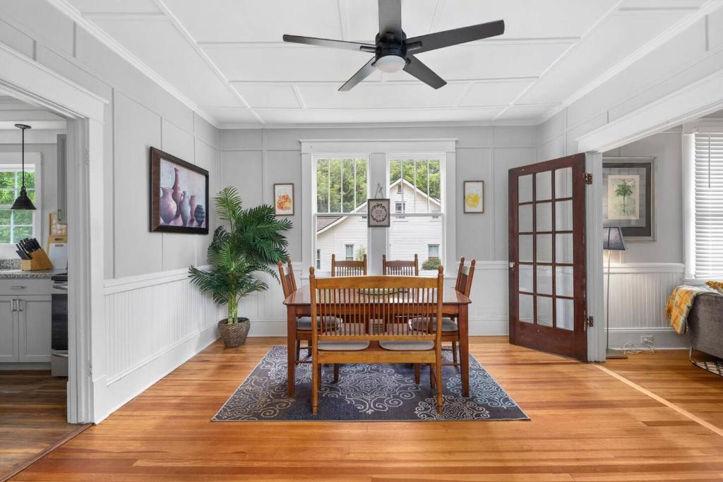 a dining room with a table and a ceiling fan at Century-Old Remodeled Splendor in Salisbury