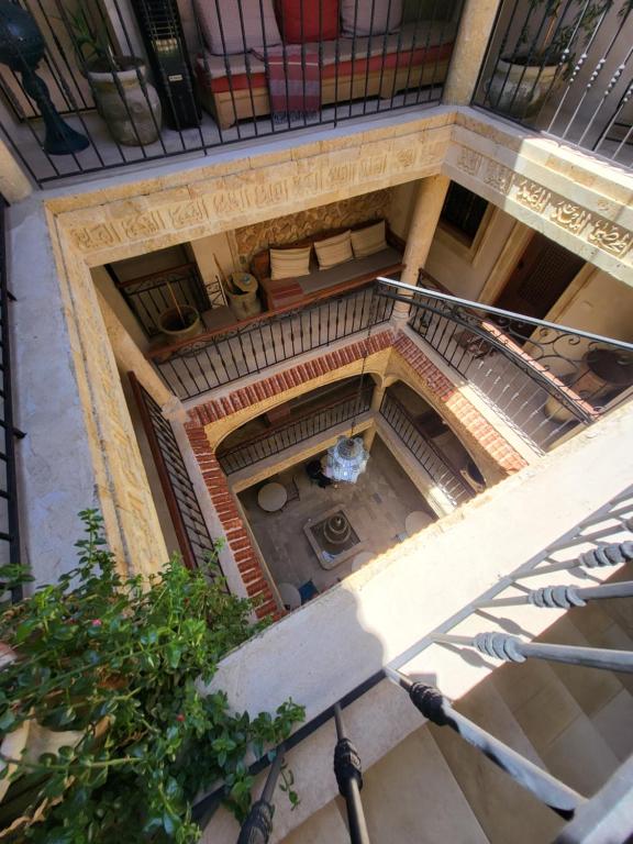 an overhead view of a building with a spiral staircase at Al Madina, traditional Riad in Bizerte