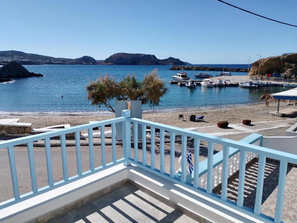 a view of the beach from the balcony of a house at Aristeidis villas in Foiníkion