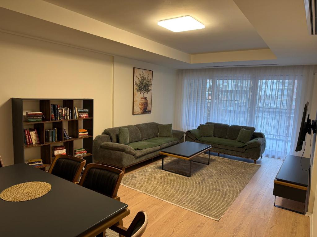 a living room with a couch and a table at OMA Residence in Ferizaj