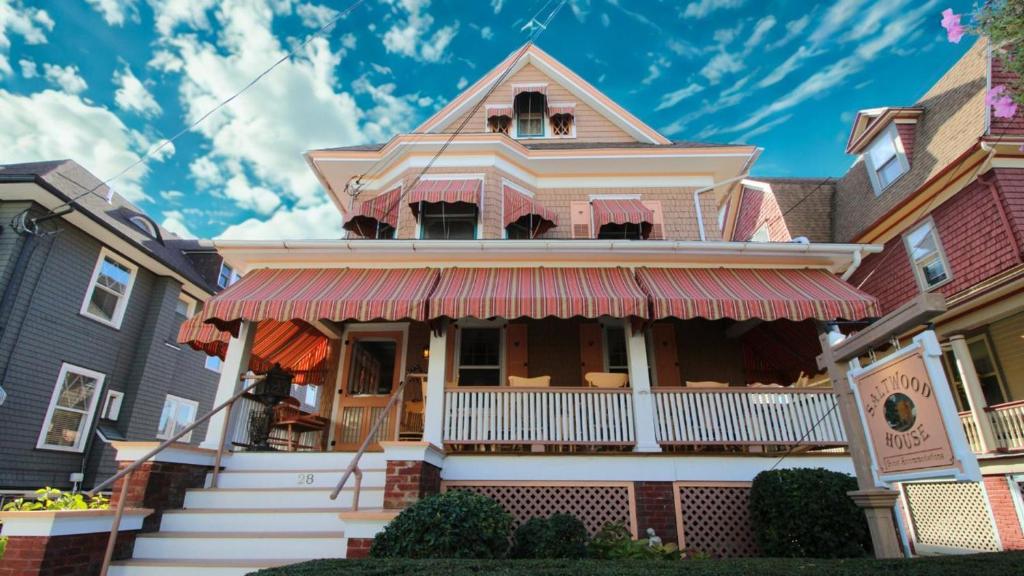 a house with an awning on the front of it at Saltwood House in Cape May