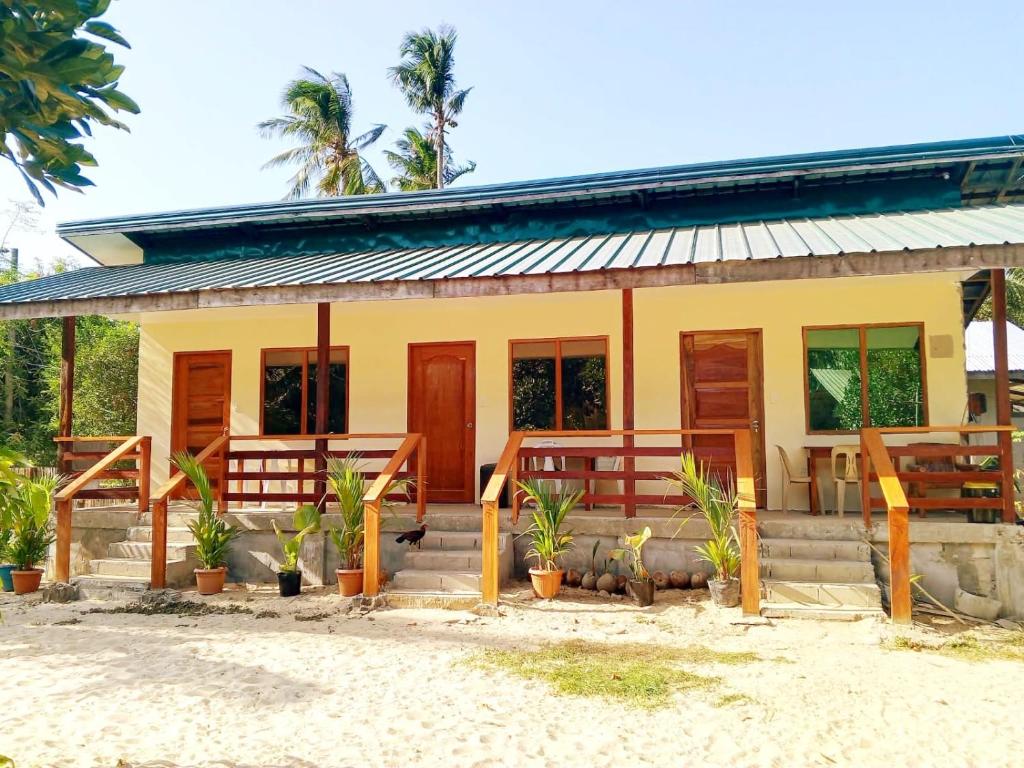 a house on the beach with plants in front at Gregorio's Inn in San Vicente
