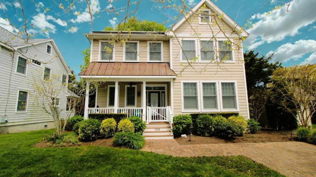 a large white house with a porch at 320 Knox Avenue, Cape May Point in Cape May Point