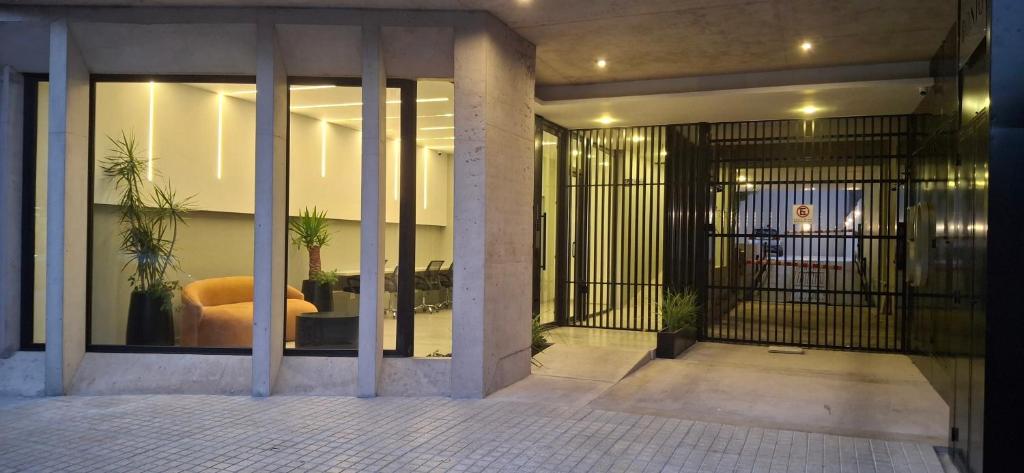 an entrance to a building with a door with a gate at Depto Zona Güemes Mdp in Mar del Plata