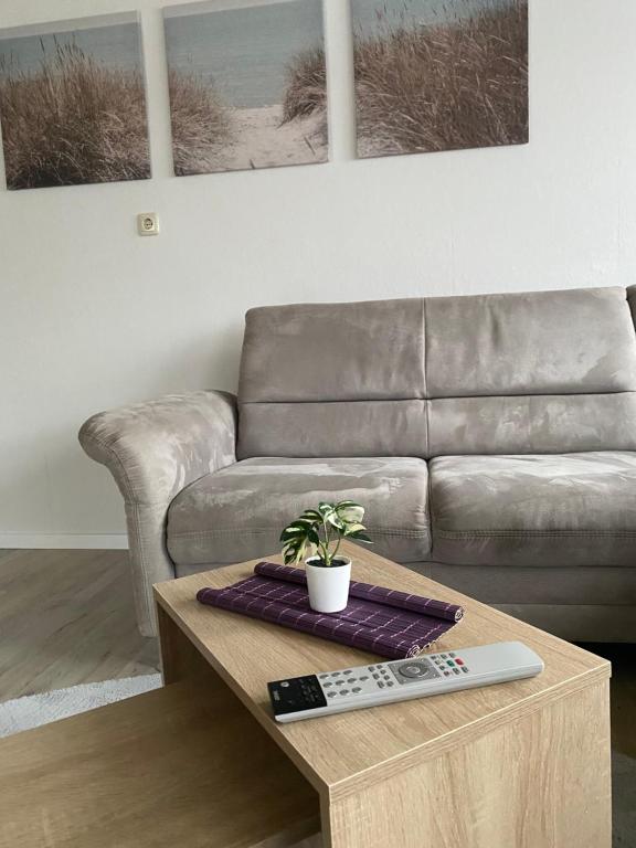 a living room with a couch and a coffee table at Ferienhaus in der Altmark in Kakerbeck