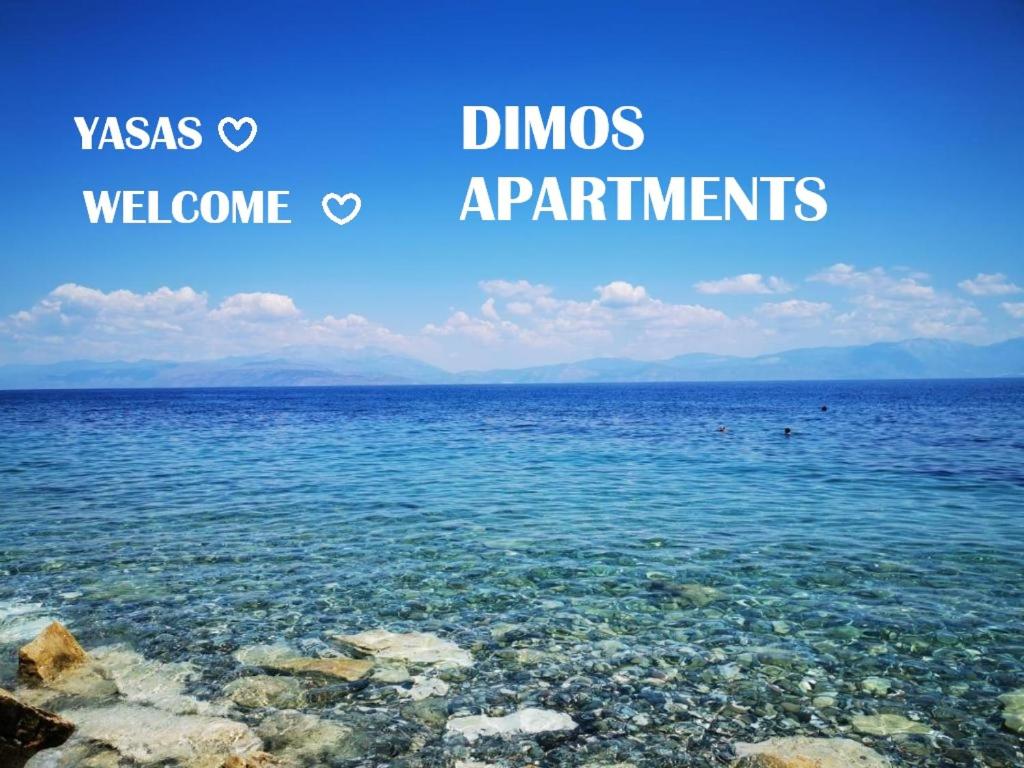 a picture of the ocean with the words dums andannis apartments at Dimos Apartments in Likoporiá