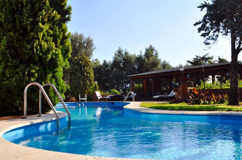a swimming pool in a yard with a house at Small Paradise Palermo in Palermo