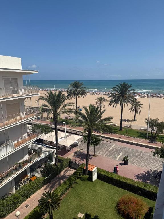 a view of the beach from the balcony of a resort at Costa blancavibes, Solo Familias in Playa de Gandia