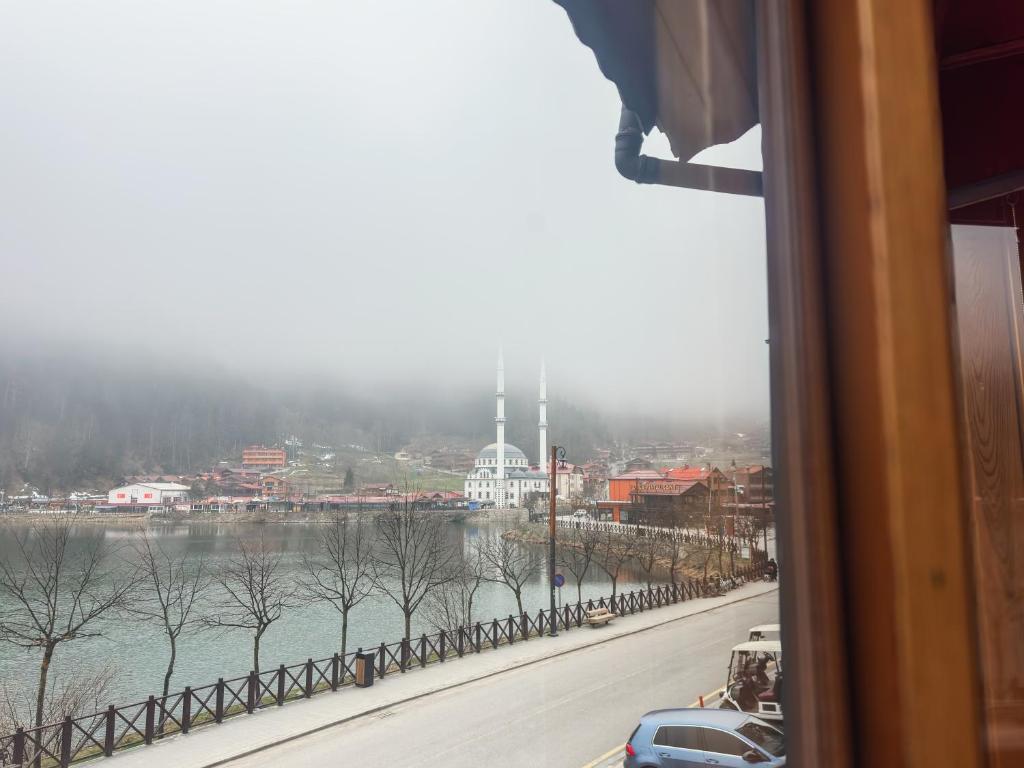a view from a window of a river and a city at Doga Motel in Uzungöl