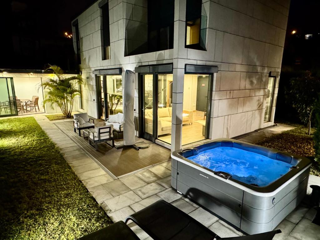 a hot tub in the backyard of a house at Square house in Funchal
