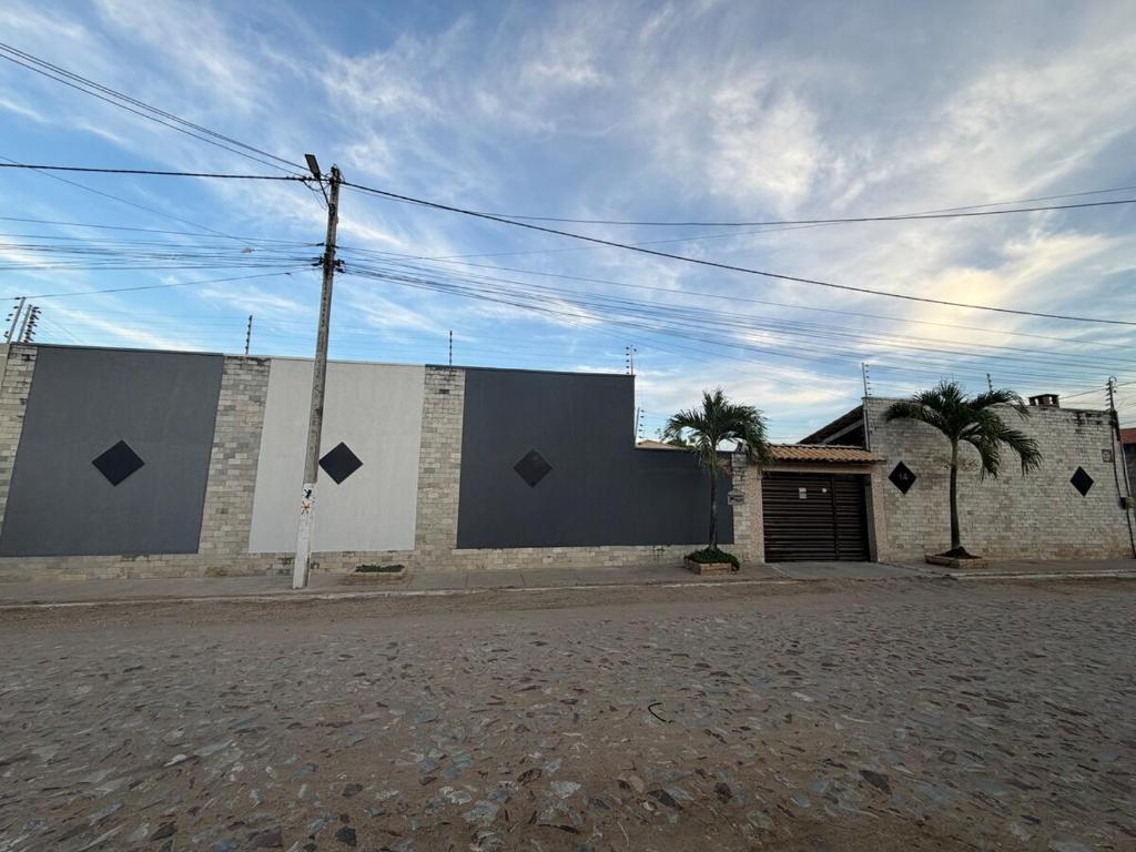 a building on the side of a street at Paracas House in Paracuru