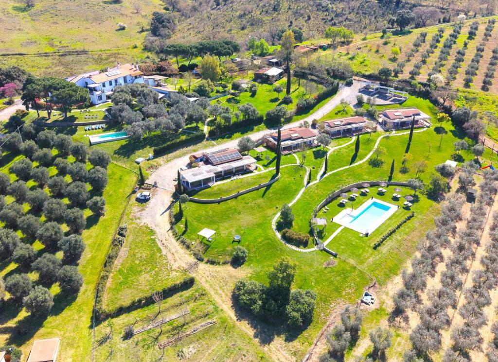 an aerial view of a villa with a garden and a house at Podere n°8 Agriturismo in Maremma in Alberese