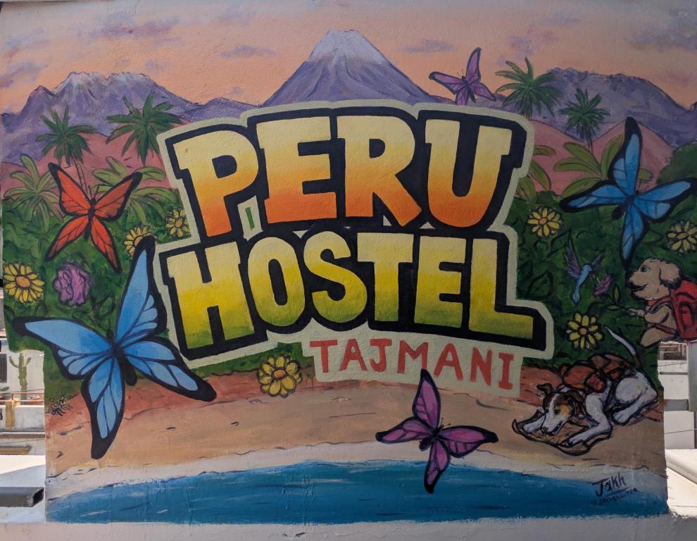 a sign that reads peru hospital tamani painted on a wall at Peru Hostel Tajmani in Arequipa