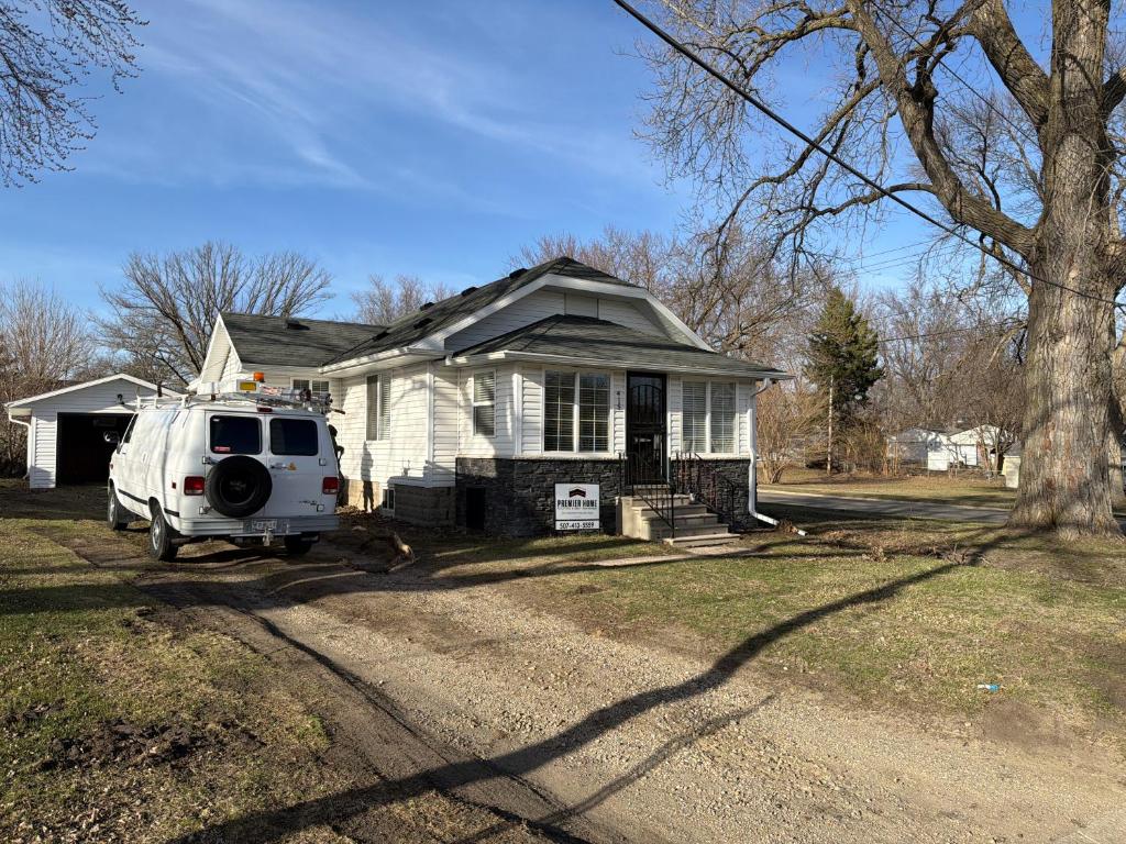 a white van parked in front of a house at Albert Lea revival in Albert Lea