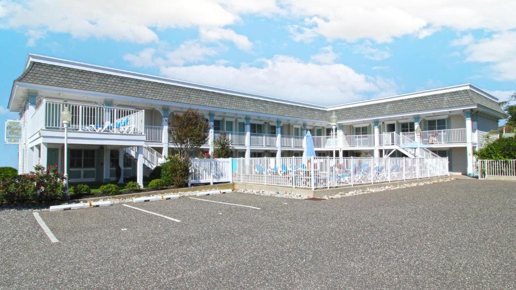 a building with a lot of umbrellas in a parking lot at Broadway Beach Unit 7 in Cape May