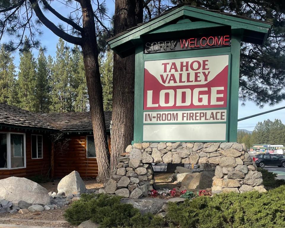 a sign for a table valley lodge in front of a house at Tahoe Valley Lodge in South Lake Tahoe