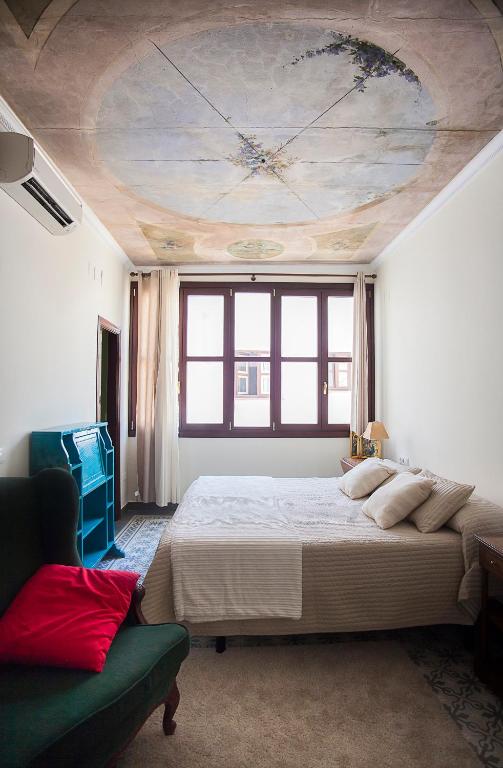 Łóżko lub łóżka w pokoju w obiekcie Angeles House