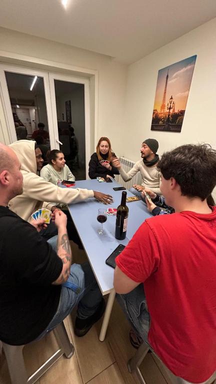 a group of people sitting around a table at Varandas do Porto Coliving in Porto