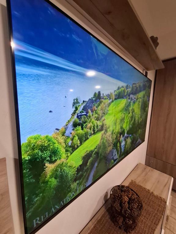 a large screen television on a wall in a room at Casa Nicolae in Brăila