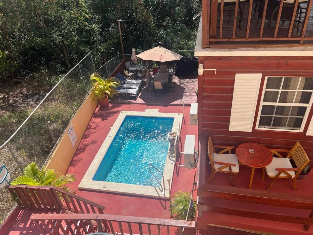 an overhead view of a swimming pool next to a house at Caribbean Dream Vacation Property CD6 in Rodney Bay Village