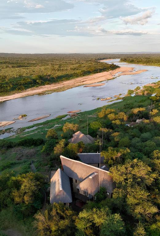 an aerial view of a house next to a river at Kruger Private Lodge in Marloth Park