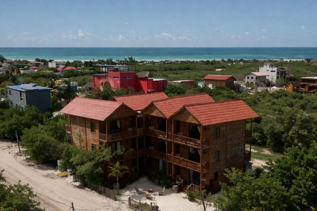 an aerial view of a building with the ocean in the background at Krak-Inn Holbox - Pet Friendly in Holbox Island