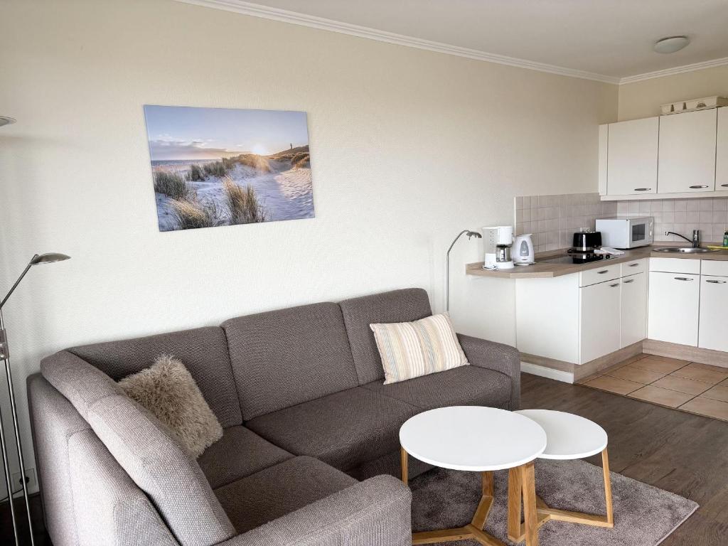 a living room with a couch and a table at Germania-60 in Böhl