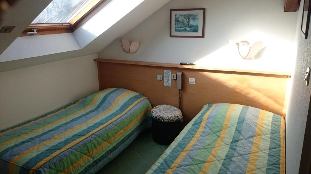 Postel nebo postele na pokoji v ubytování Sud Hotel