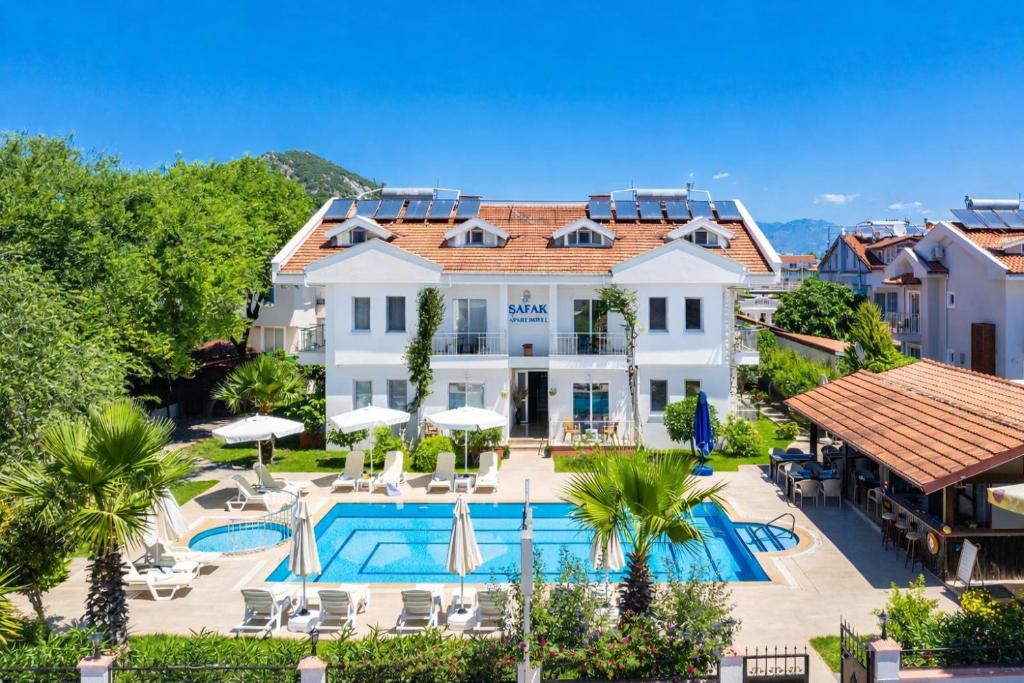 an image of a hotel with a swimming pool at Safak Hotel Dalyan in Dalyan