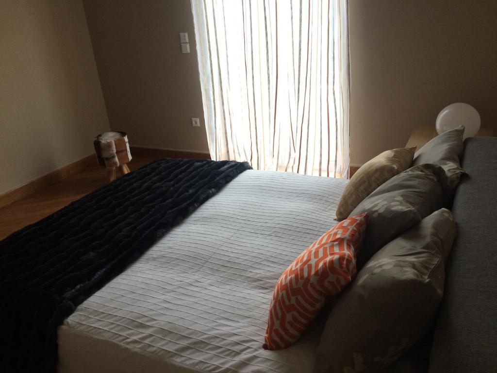 Lux Kolonaki Apartmentにあるベッド