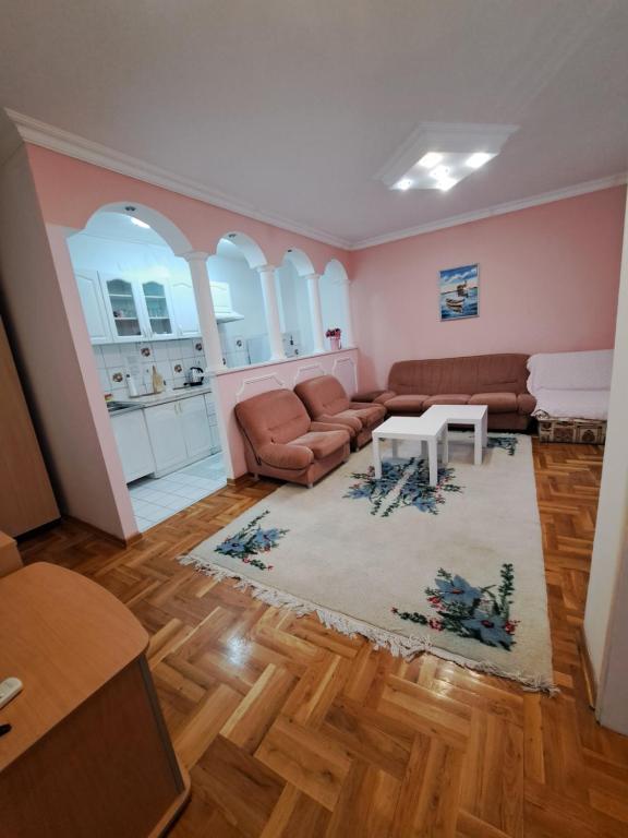 a living room with a couch and a table at Apartment Gajic in Belgrade
