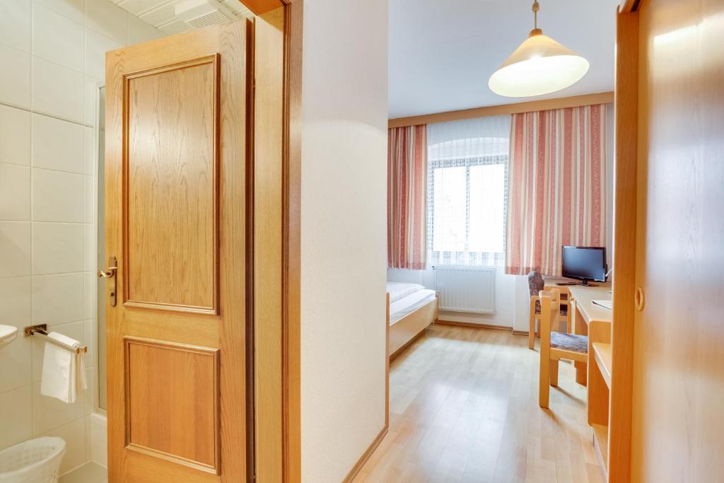 Postel nebo postele na pokoji v ubytování Hotel Himmelreich