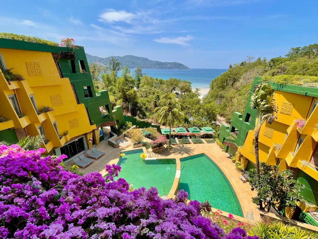 an aerial view of a resort with a swimming pool and the ocean at Kata Seaview Escape - 1BR Luxury Apartment 90sqm in Phuket