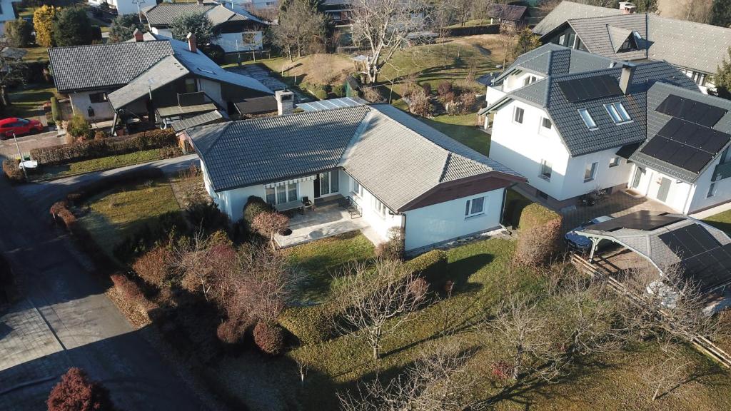 an overhead view of a white house with a gray roof at Ani's Pearl in Bled