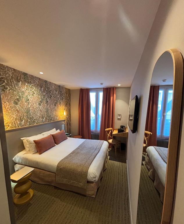 Postel nebo postele na pokoji v ubytování Parici Hôtel Boulogne Billancourt
