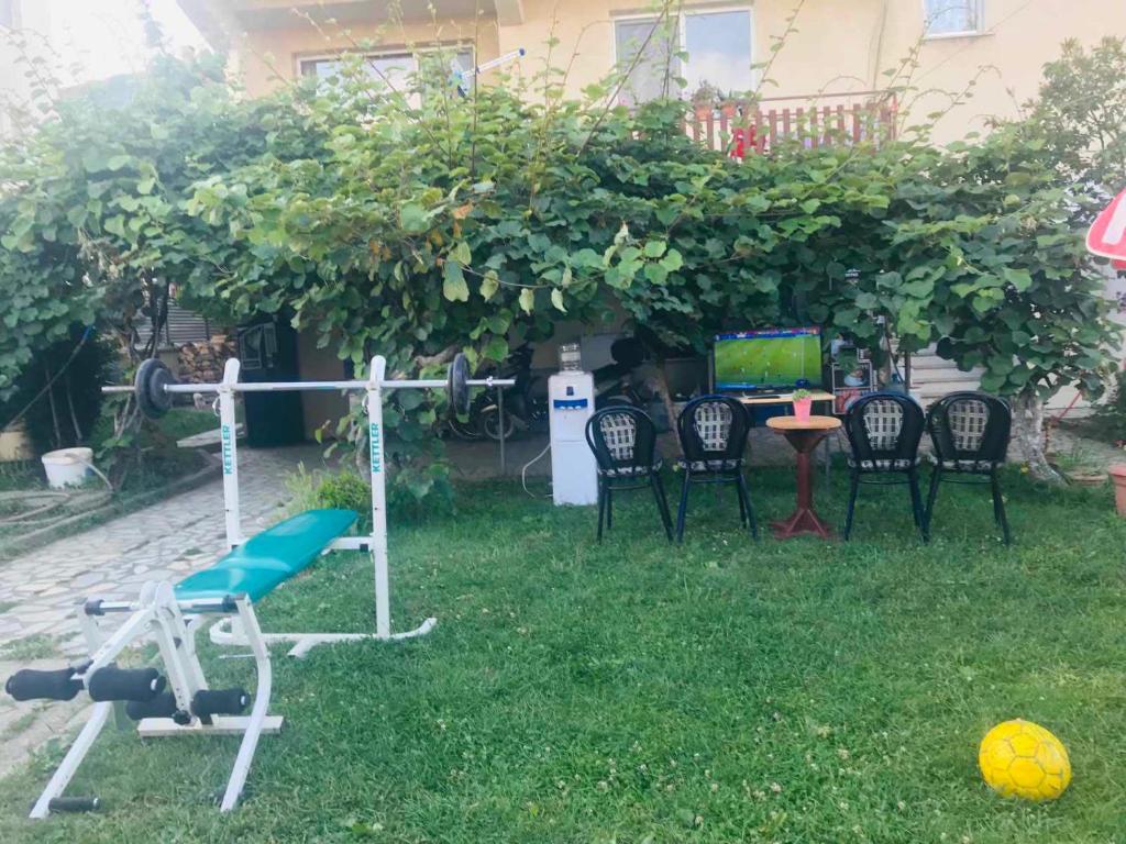 a group of chairs and a television in a yard at Hostel Struga in Struga