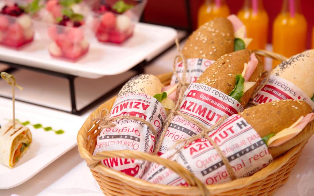 a basket filled with sandwiches on a table at AZIMUT Hotel Siberia in Novosibirsk