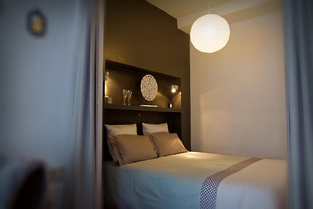 Säng eller sängar i ett rum på Appartement Saint-Sauveur
