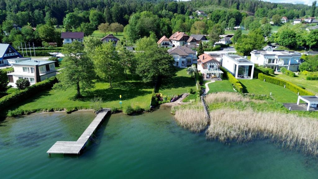 an aerial view of a lake with a dock at Seevilla Nina in Maria Wörth