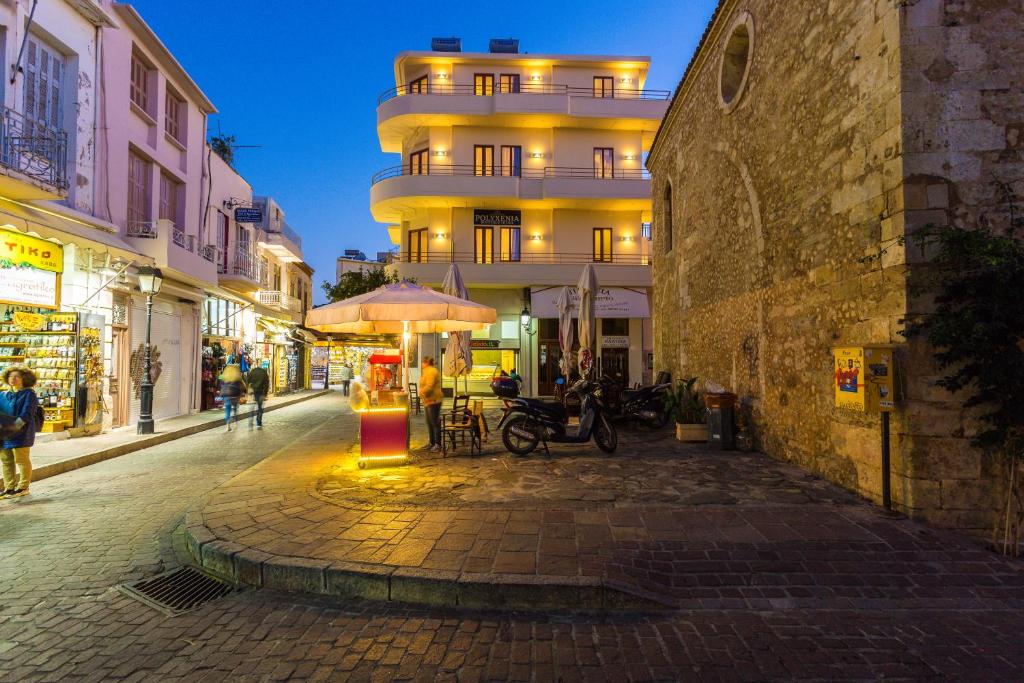 a city street at night with a building at Polyxenia Suites in Rethymno Town