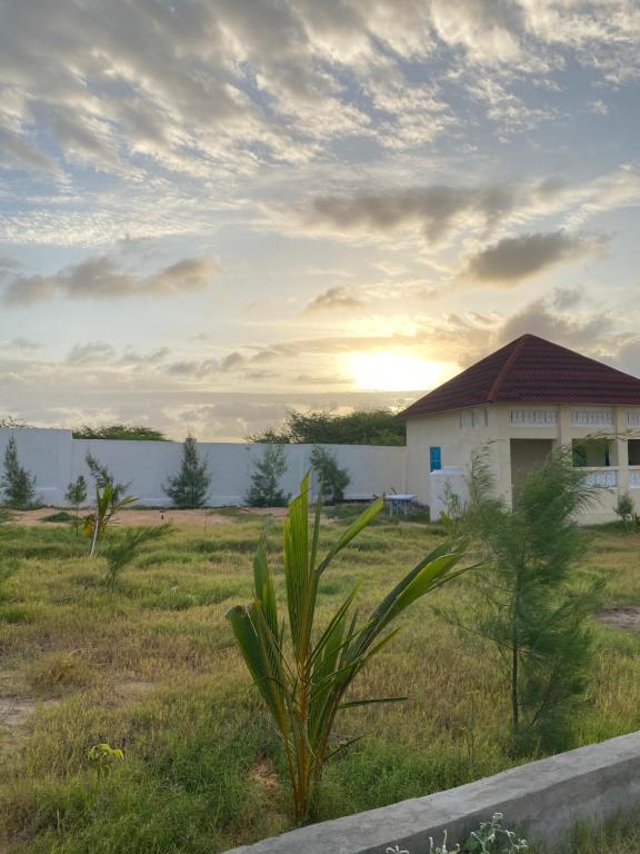 a house in the middle of a field at Maan Resort in Mogadishu